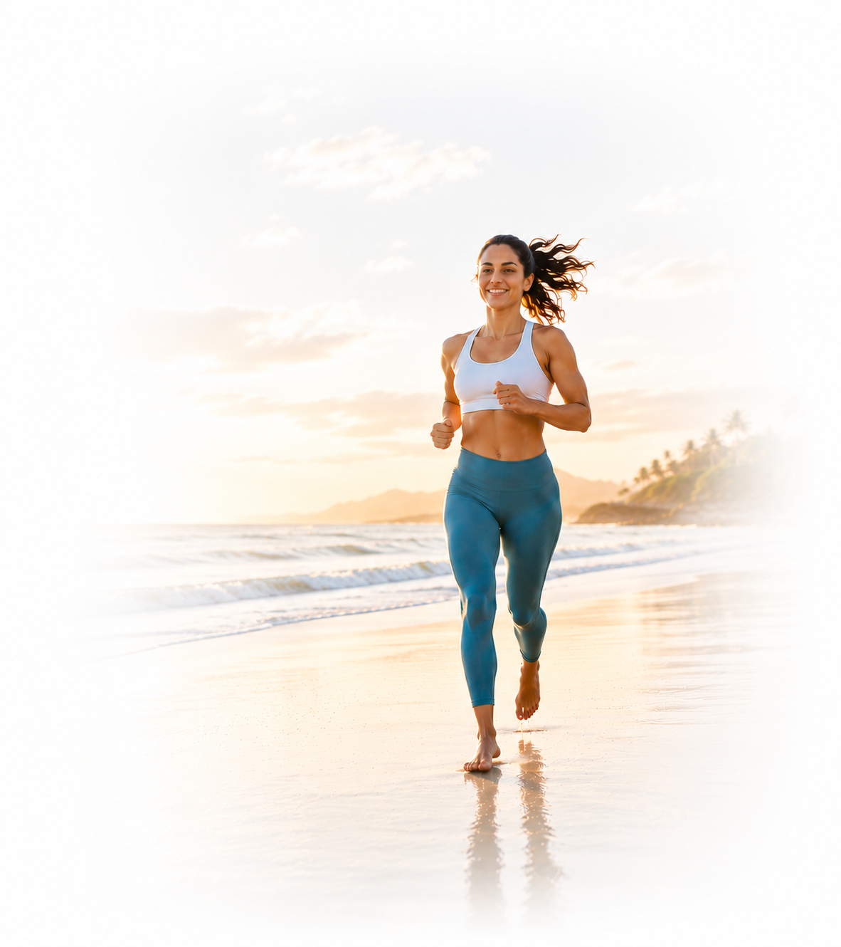 Healthy woman running on beach at sunrise
